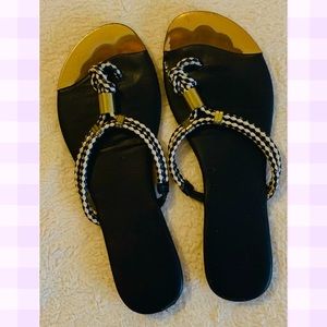Black sandals with gold details